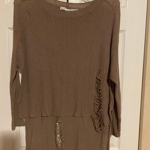 Distressed sweater. Longer in back